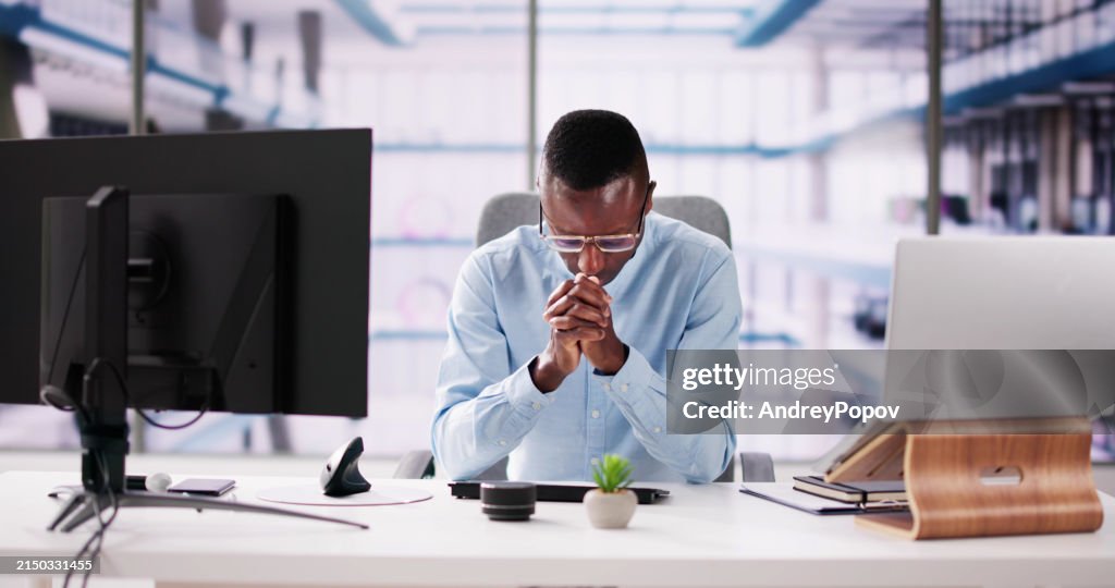 Contemplative Business Man At Desk