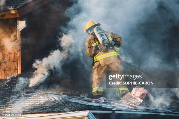 saint-hugues fire disaster - firemen fighting house fires stock pictures, royalty-free photos & images
