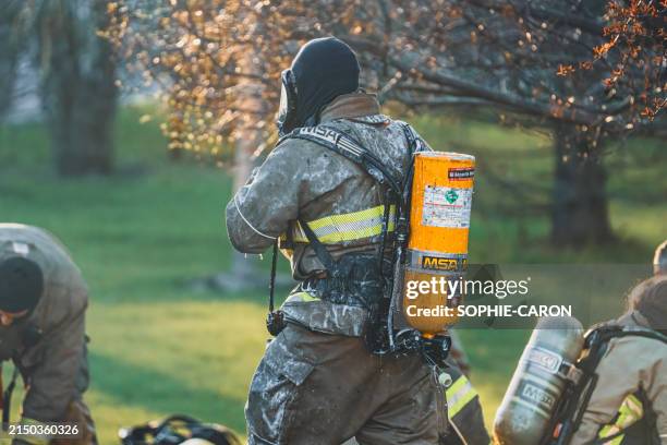 saint-hugues fire disaster - firefighter pole stock pictures, royalty-free photos & images