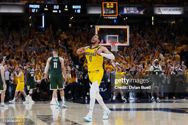 Tyrese Haliburton of the Indiana Pacers celebrates after beating the Milwaukee Bucks 121-119 in overtime during game three of the Eastern Conference...