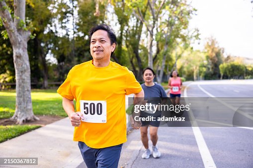 Pinoy Jogging Mature Filipino Man Running In A Marathon Race High-Res Stock Photo ...
