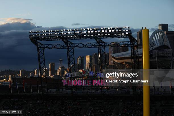 General view of the Space Needle, Seattle's skyline and Lumen Field as the sun sets during the sixth inning between the Seattle Mariners and the...