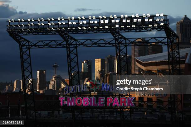 General view of the Space Needle, Seattle's skyline and Lumen Field as the sun sets during the sixth inning between the Seattle Mariners and the...