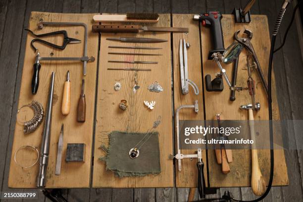 jeweler craft workshop vintage and modern jeweler tools on rustic wooden table - hand tool stock pictures, royalty-free photos & images