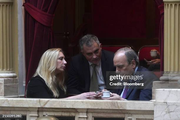 Karina Milei, seated left, Argentina's secretary general of the presidency, and Guillermo Franco, Argentina's interior minister, seated right, attend...