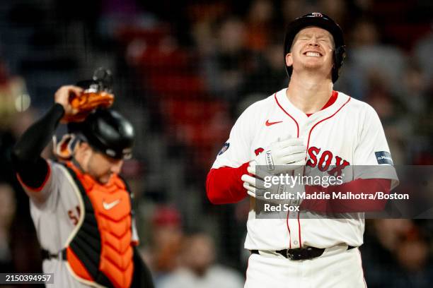 Garrett Cooper reacts after being hit by a pitch in the fifth inning of his Red Sox debut against the San Francisco Giants on April 30, 2024 at...