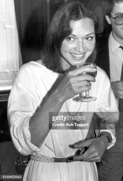 British Broadcaster and Journalist Anna Ford enjoys a drink at a party in London, UK, on June 6, 1983.