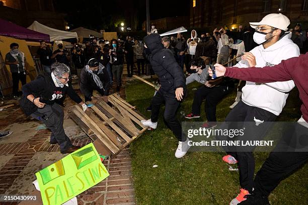 Counter protesters attack pro-Palestinian protesters at a pro-Palestinian encampment set up on the campus of the University of California Los Angeles...