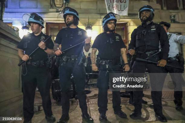 New York Police Department officers detain dozens of pro-Palestinian students at Columbia University after they barricaded themselves at the Hamilton...