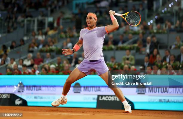 Rafael Nadal of Spain plays a forehand against Alex de Minaur of Australia in the Men's Singles Round of 64 match during Day Five of the Mutua Madrid...