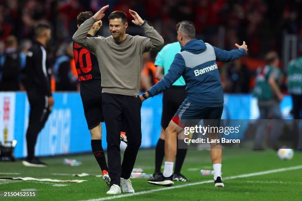 Xabi Alonso, Head Coach of Bayer Leverkusen, reacts after Robert Andrich of Bayer Leverkusen scores his team's second goal during the Bundesliga...