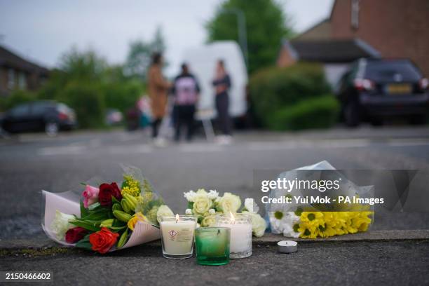Floral tributes and candles in Hainault, north east London, where a 14-year-old Daniel Anjorin, was killed in a sword attack on Tuesday, that saw...