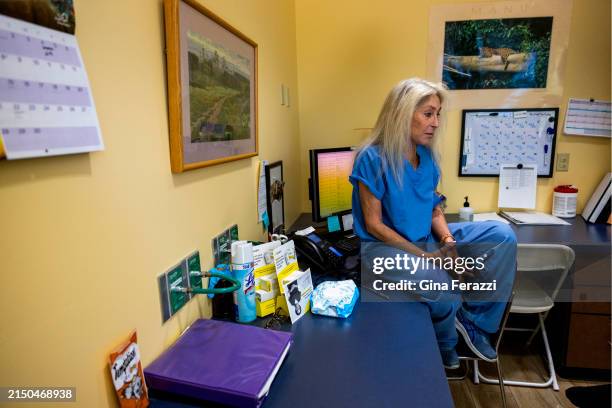 Dr. Barbara Zipkin of Sherman Oaks contemplates while sitting on a counter top at Camelback Family Planning on April 18, 2024 in Phoenix, Arizona....