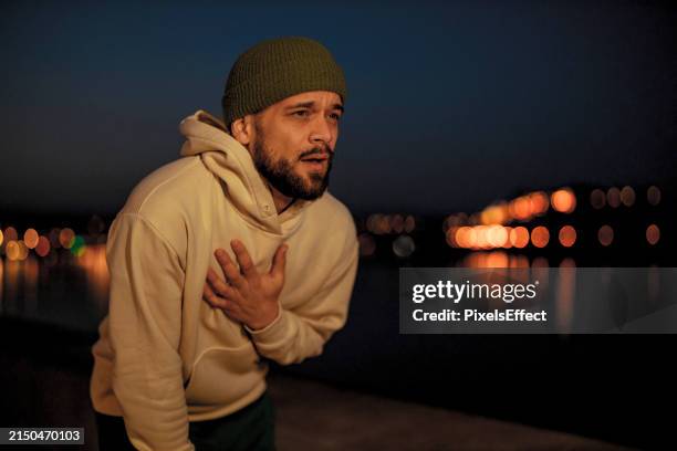 runner and heart attack pain - chest pain while running stock pictures, royalty-free photos & images