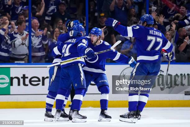 Steven Stamkos of the Tampa Bay Lightning celebrates with teammates after scoring against the Florida Panthers during the first period during Game...