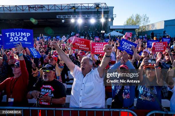 The crowd reacts while Republican presidential candidate, former U.S. President Donald Trump speaks during a rally on May 1, 2024 at Avflight Saginaw...