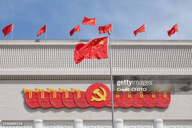 The Party flag, emblem and national flag at the Historical Exhibition Hall of the Communist Party of China in Beijing, May 1, 2024.