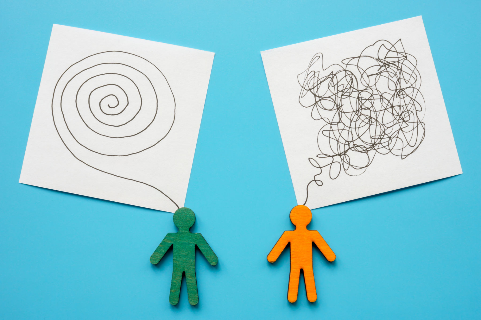 Figures of people and stickers symbolizing ordered thoughts, mentoring and chaos, questions. Figures of people and stickers symbolizing ordered thoughts, mentoring and chaos, questions.