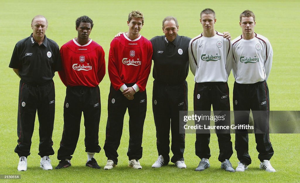 Gerard Houllier poses with new signings