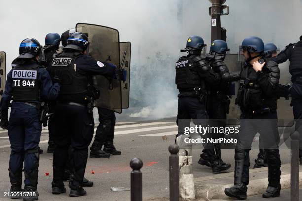 Riot police are confronting demonstrators using tear gas during the annual protest marking International Labour Day, also known as Workers Day or May...