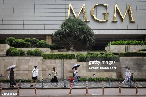 Pedestrians pass the MGM Cotai casino resort, developed by MGM China Holdings Ltd., in Macau, China, on Thursday, May 2, 2024. Macau's casino...
