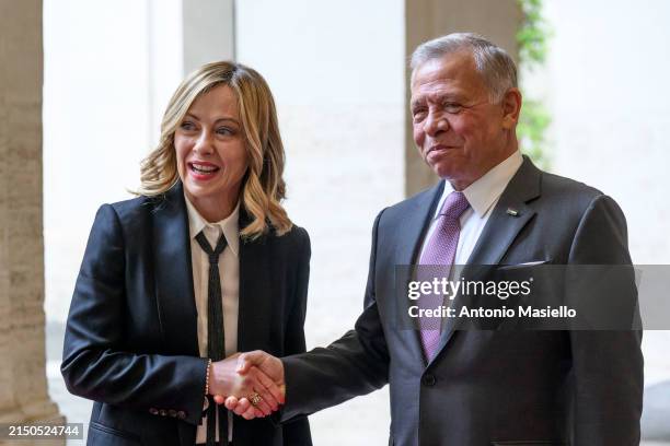 King of Jordan Abdullah II bin Al-Hussein and Italian Prime Minister Giorgia Meloni shake hands before their meeting at Palazzo Chigi, on May 2, 2024...