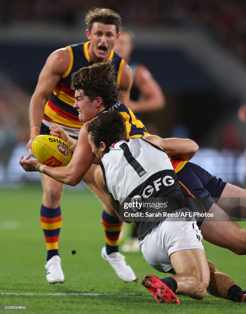 Connor Rozee Crows Ned McHenry of the Crows is tackled by Connor Rozee of the Power ...