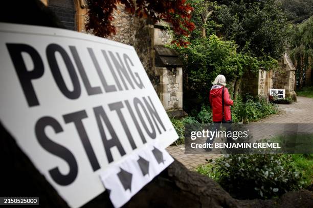 Voter arrives at a polling station located at Saint Saviour Church in Chalk Farm, north London, to cast her vote in local elections, on May 2, 2024....