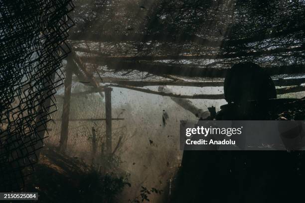 Ukrainian soldier from the 30th Mechanised Brigade fires 2S1 Gvozdika Howitzer at shooting artillery positions as the Russia-Ukraine war continues in...