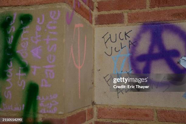 Antisemitic writing on a wall is seen in a Pro-Palestinian protestor encampment at the University of California, Los Angeles campus on May 2, 2024 in...