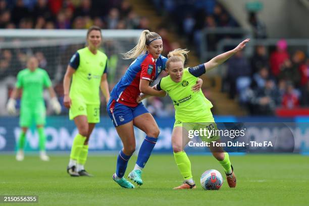 Katie Kitching of Sunderland is challenged by Lexi Potter of Crystal Palace during the Barclays Women's Championship match between Crystal Palace and...