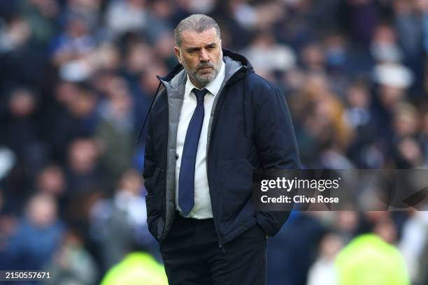 Ange Postecoglou, Manager of Tottenham Hotspur, looks dejected after the team's defeat during the Premier League match between Tottenham Hotspur and...