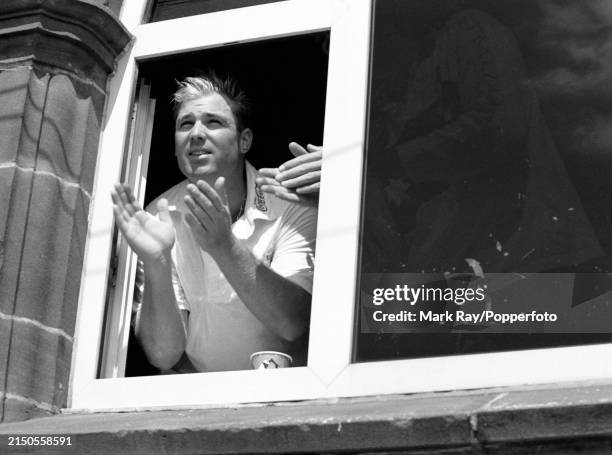 Shane Warne of Australia applauding his teammate Steve Waugh after he reached his second century of the match on day four of the 3rd Test match...