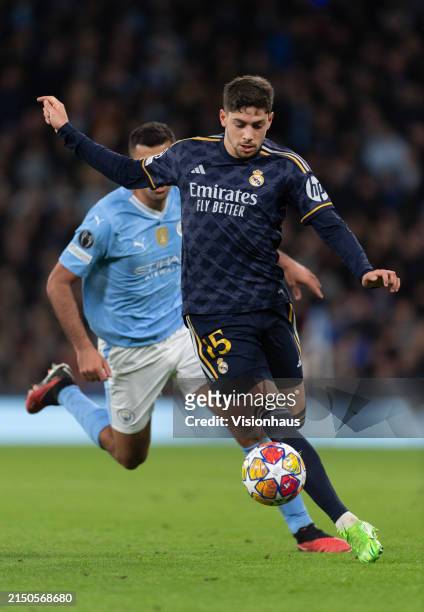 Federico Valverde of Real Madrid CF and Rodri of Manchester City in action during the UEFA Champions League quarter-final second leg match between...