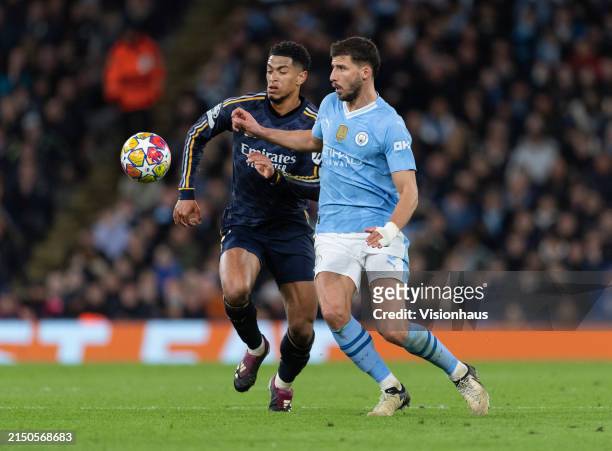 Ruben Dias of Manchester City and Jude Bellingham of Real Madrid CF in action during the UEFA Champions League quarter-final second leg match between...