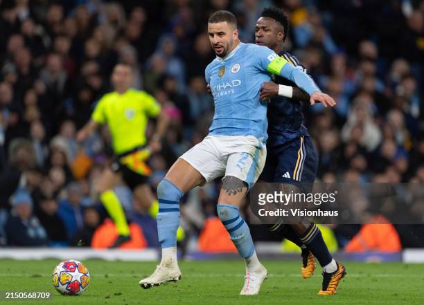 Kyle Walker of Manchester City and Vinicius Junior of Real Madrid CF during the UEFA Champions League quarter-final second leg match between...