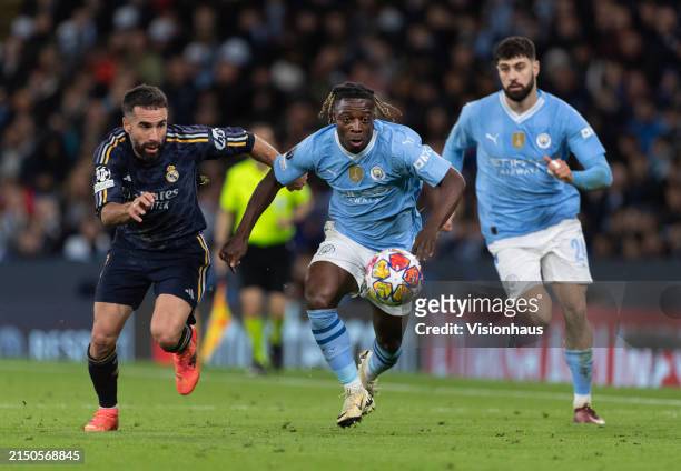 Jeremy Doku of Manchester City and Dani Carvajal of Real Madrid CF in action during the UEFA Champions League quarter-final second leg match between...