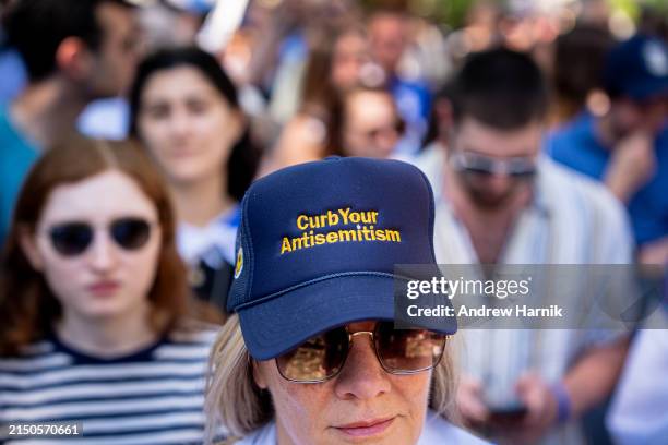 Woman wears a hat that reads "Curb Your Antisemitism" during a rally against campus antisemitism at George Washington University on May 2, 2024 in...