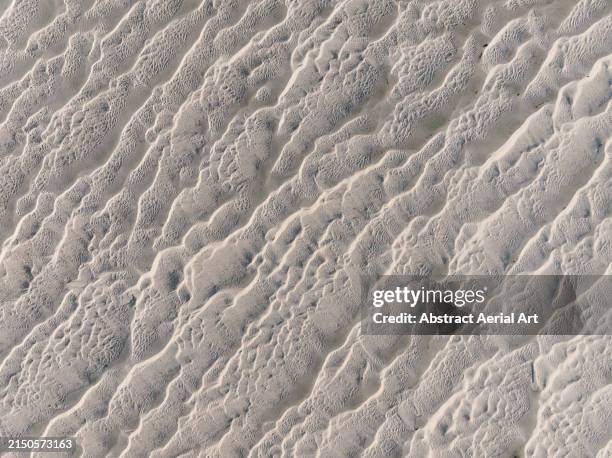 drone image looking down on abstract sand patterns in an estuary, western australia, australia - sandbar stock pictures, royalty-free photos & images