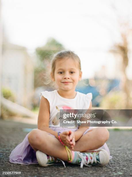 girl in unicorn dress - girl sitting criss cross stock pictures, royalty-free photos & images