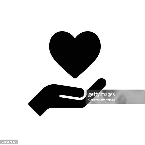 hand and heart solid icon. care, family, love concepts - trust stock illustrations