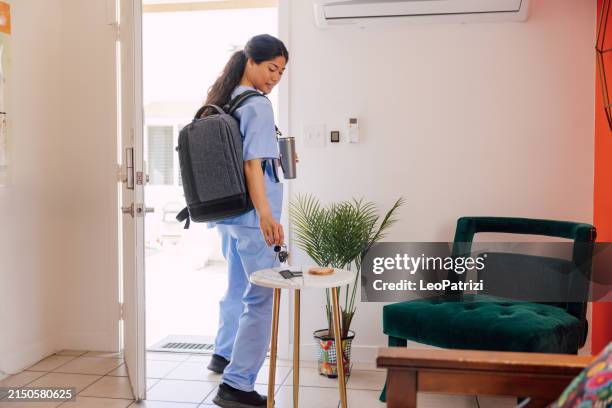 woman nurse leaving from home - annual leave stock pictures, royalty-free photos & images
