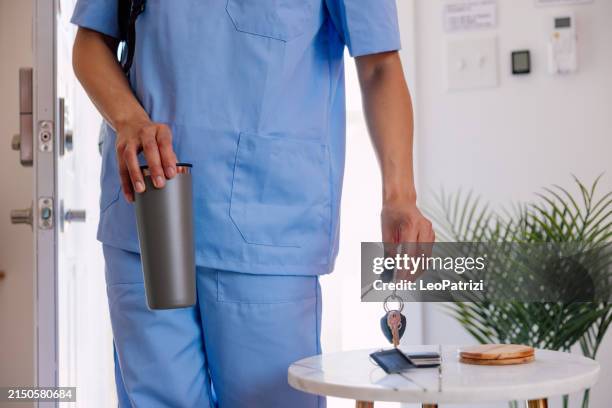 woman nurse leaving from home - annual leave stock pictures, royalty-free photos & images