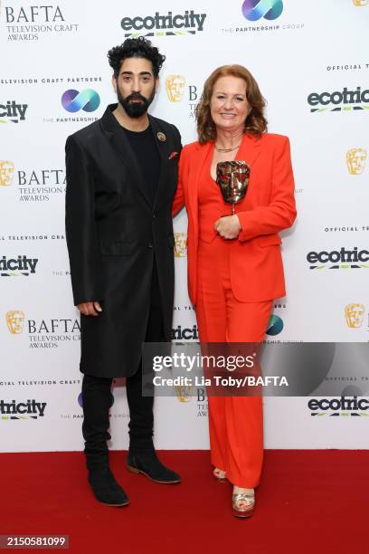 Presenter Ray Panthaki poses with Lisa Parkinson with the Make-Up & Hair Design Award, sponsored by Screenskills High-end Television Fund, for 'The...