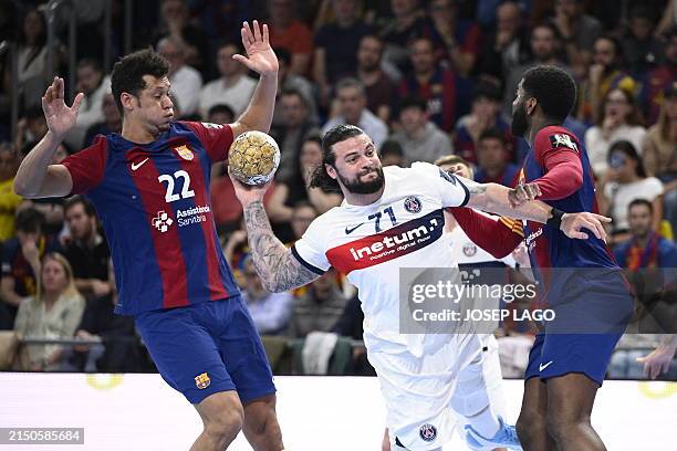 S French left back Elohim Prandi shoots despite being challenged by Barcelona's Brazilian left back Thiagus Goncalves during the EHF Champions League...