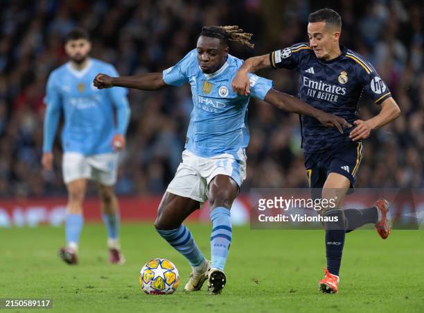 Jeremy Doku of Manchester City and Lucas Vazquez of Real Madrid CF in action during the UEFA Champions League quarter-final second leg match between...