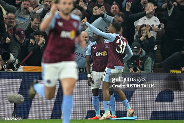 Aston Villa's French midfielder Moussa Diaby celebrates with teammates after scoring their second goal during the UEFA Europa Conference League semi...
