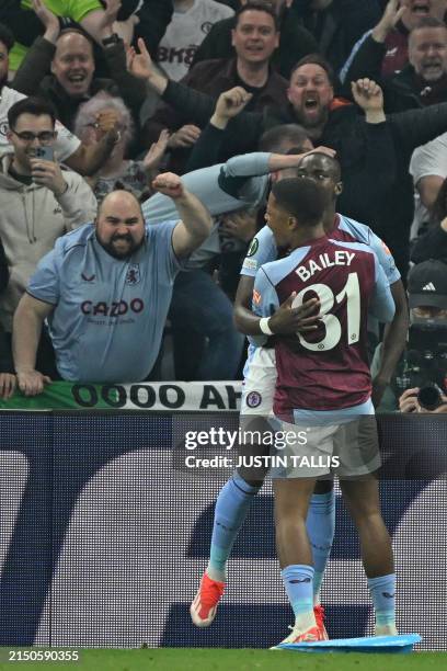 Aston Villa's French midfielder Moussa Diaby celebrates with Aston Villa's Jamaican striker Leon Bailey after scoring their second goal during the...