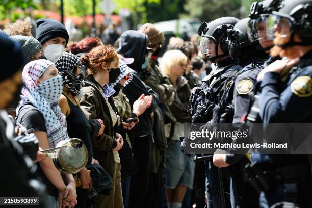 Police and pro-Palestine protesters stand-off in front of the barricaded Portland State University library on May 2, 2024 in Portland, Oregon....