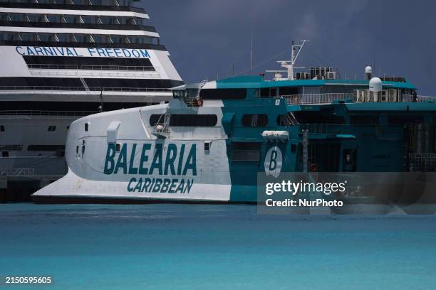 View of Carnival Freedom cruise ship and Balearia Caribbean ferry in Bimini, Bahamas on May 1, 2024.
